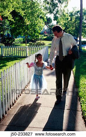 Stock Photo - Father & daughter. Young girl in princess costume. Fotosearch