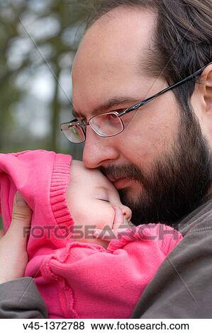 Father holding baby daughter. View Large Photo Image Stock Photo - Father holding baby daughter.. Fotosearch
