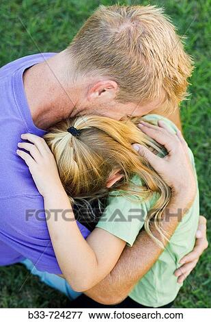 Father holding child closely View Large Photo Image Stock Photo - Father holding child closely. Fotosearch