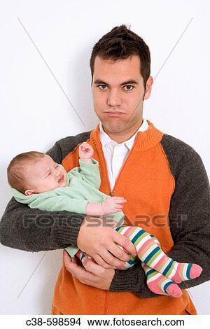 Father Holding his Crying Baby Girl View Large Photo Image Picture - Father Holding his Crying Baby Girl. Fotosearch
