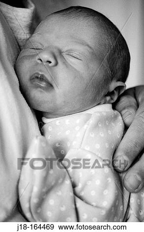 Father holding newborn View Large Photo Image Stock Photo - Father holding newborn. Fotosearch