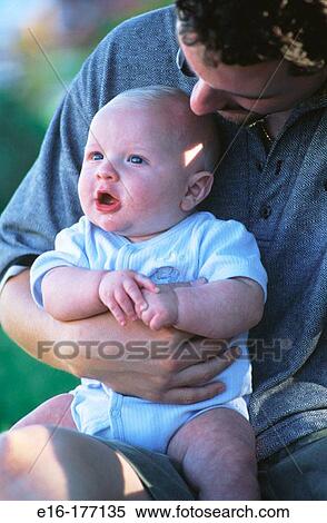 Father holding newborn View Large Photo Image Stock Photography - Father holding newborn. Fotosearch