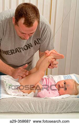 Father looks after baby. View Large Photo Image Stock Photo - Father looks after baby.. Fotosearch