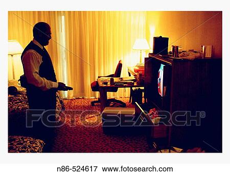 Stock Photo - Father of bride watching television. Fotosearch