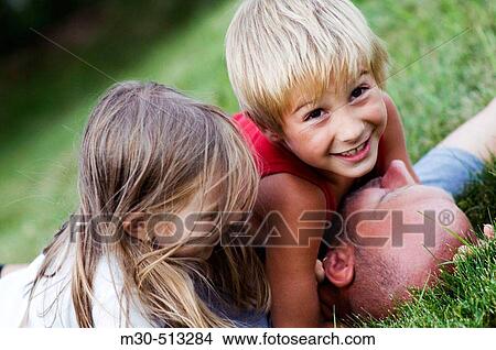 Father playing with his kids. View Large Photo Image Picture - Father playing with his kids.. Fotosearch