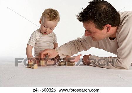 Father playing with his son View Large Photo Image Stock Photography - Father playing with his son. Fotosearch