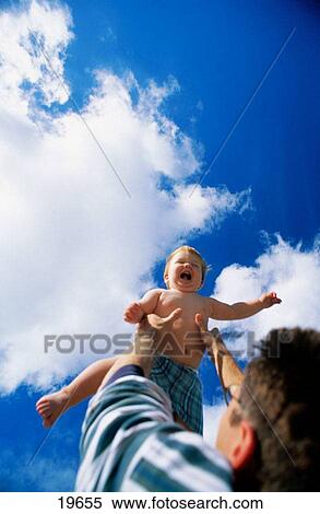 Father throwing son in air View Large Photo Image Stock Photography - Father throwing son in air. Fotosearch