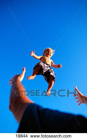 Picture - Father throwing up son. Fotosearch