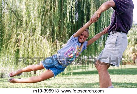 father twirling daughter View Large Photo Image Stock Photo - father twirling daughter. Fotosearch