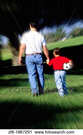 Father walking hand in hand with son View Large Photo Image Stock Image - Father walking hand in hand with son. Fotosearch