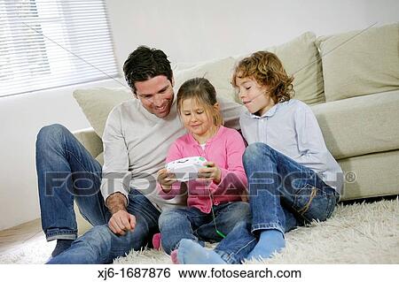 Stock Photograph - Father with children. Fotosearch