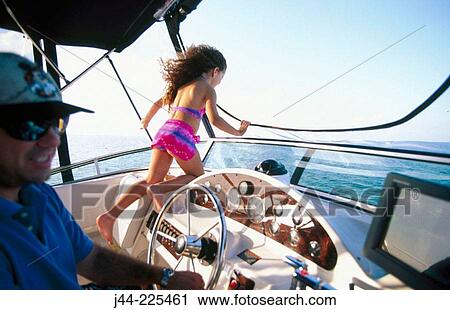 Father with daughter in boat's helm View Large Photo Image Stock Image - Father with daughter in boat's helm. Fotosearch