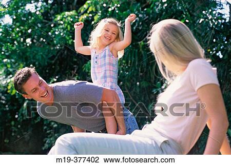 father with daughter, mother watching View Large Photo Image Stock Image - father with daughter, mother watching. Fotosearch