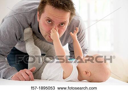Father with his baby son View Large Photo Image Stock Image - Father with his baby son. Fotosearch
