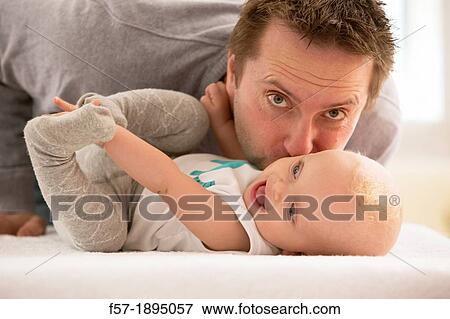 Father with his baby son View Large Photo Image Stock Photo - Father with his baby son. Fotosearch