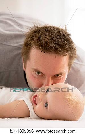 Father with his baby son View Large Photo Image Stock Photograph - Father with his baby son. Fotosearch