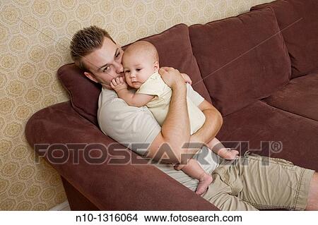 Father with his six-month old son View Large Photo Image Picture - Father with his six-month old son. Fotosearch