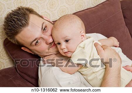 Father with his six-month old son View Large Photo Image Stock Image - Father with his six-month old son. Fotosearch