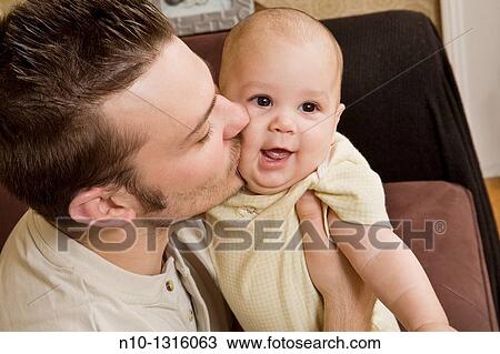Father with his six-month old son View Large Photo Image Stock Image - Father with his six-month old son. Fotosearch