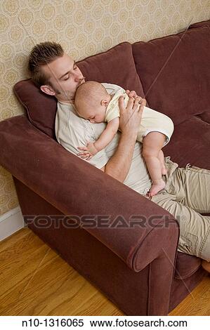 Father with his six-month old son View Large Photo Image Stock Photography - Father with his six-month old son. Fotosearch