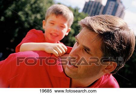 Father with son on shoulders View Large Photo Image Stock Photography - Father with son on shoulders. Fotosearch