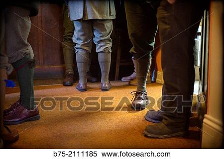 feet and legs of people dressed in typical hunting suit, after a pheasant hunting in a pub in Yorkshire Dales, England, UK, Europe View Large Photo Image Stock Photography - feet and legs of people dressed in typical hunting suit, after a pheasant hunting in a pub in Yorkshire Dales, England, UK, Europe. Fotosearch