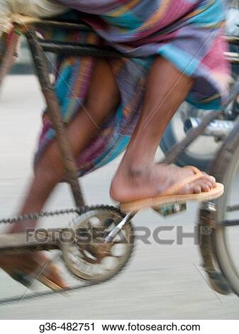 Feet of bicycle rickshaw driver at work in Dhaka, Bangladesh View Large Photo Image Stock Image - Feet of bicycle rickshaw driver at work in Dhaka, Bangladesh. Fotosearch