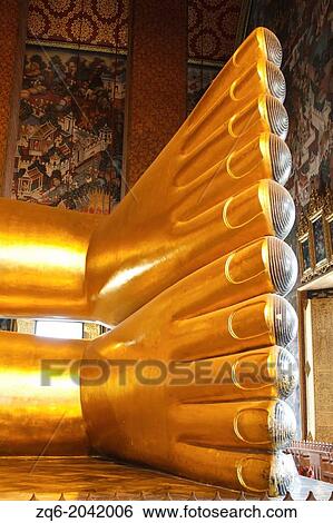 Stock Photograph - Feet of the Reclining Buddha in the Temple Wat Pho in Bangkok, Thailand. Fotosearch