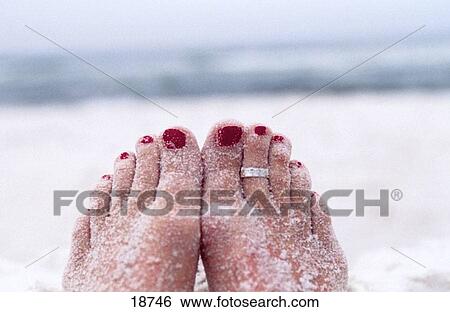 Stock Photograph - Feet on sand. Fotosearch