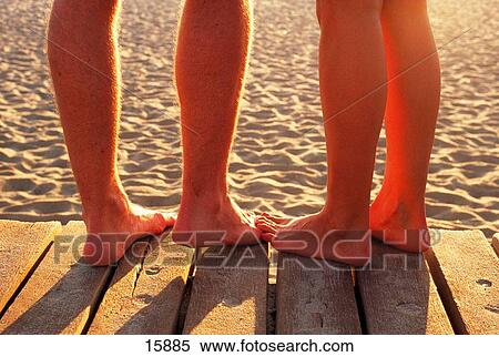 Feet together at the beach boardwalk View Large Photo Image Stock Photography - Feet together at the beach boardwalk. Fotosearch