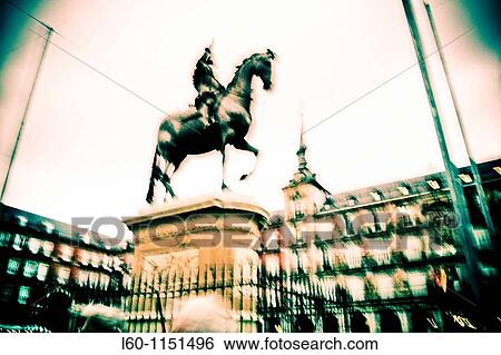 Stock Photograph - Felipe III statue at Plaza Mayor Madrid Spain. Fotosearch