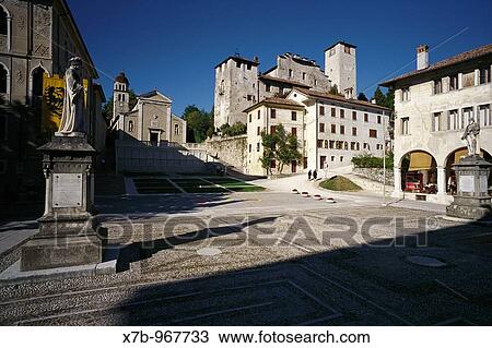 Stock Image - Feltre Italy Piazza Maggiore & the remains of the medieval castle. Fotosearch