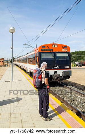 Female backpacker waiting for the Palencia to Santander train at Monzon de Campos station Palencia province, Castilla-Leon, Spain Europe View Large Photo Image Stock Image - Female backpacker waiting for the Palencia to Santander train at Monzon de Campos station Palencia province, Castilla-Leon, Spain Europe. Fotosearch