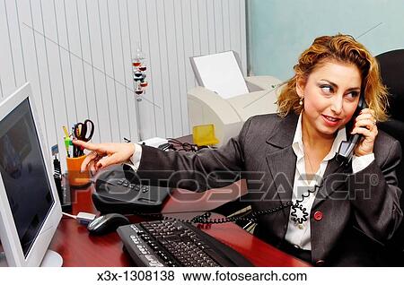 Female businesswoman pinpointing information on the screen to colleagues while talking on the phone View Large Photo Image Stock Photo - Female businesswoman pinpointing information on the screen to colleagues while talking on the phone. Fotosearch