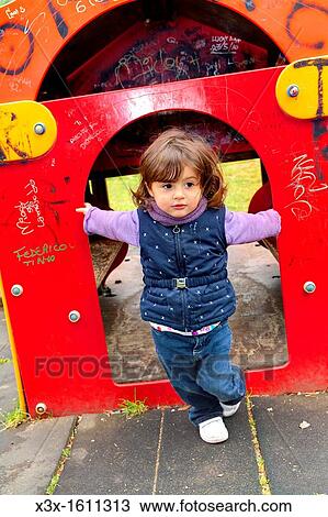 Female child at a playground View Large Photo Image Stock Image - Female child at a playground. Fotosearch