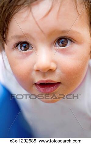 Stock Photography - Female child looking upwards. Fotosearch