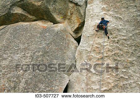 Female climber leading a route in City of Rocks, Idaho, USA View Large Photo Image Stock Photo - Female climber leading a route in City of Rocks, Idaho, USA. Fotosearch