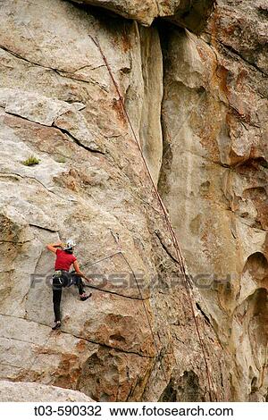 Female climber reaching the top of a route in the City of Rocks, Idaho, USA. View Large Photo Image Stock Image - Female climber reaching the top of a route in the City of Rocks, Idaho, USA.. Fotosearch