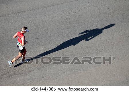 Stock Photography - Female Competitor in the Iron Man Triathlon Competition, Summerstrand, Port Elizabeth, Eastern Cape, South Africa. Fotosearch