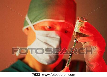 Female doctor in mask View Large Photo Image Stock Image - Female doctor in mask. Fotosearch