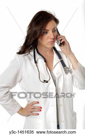 Female Doctor with stethoscope talking on the phone View Large Photo Image Stock Photography - Female Doctor with stethoscope talking on the phone. Fotosearch
