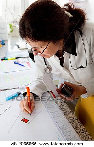 Female doctor writes a prescription View Large Photo Image Stock Photography - Female doctor writes a prescription. Fotosearch