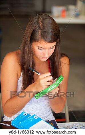 Female doctor's assistant, 23 years old, caucasian, filling out medication instructions at a provisional vet clinic, Leakey, Texas, USA View Large Photo Image Stock Image - Female doctor's assistant, 23 years old, caucasian, filling out medication instructions at a provisional vet clinic, Leakey, Texas, USA. Fotosearch