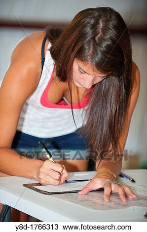Female doctor's assistant, 23 years old, caucasian, filling out paper work at a provisional vet clinic, Leakey, Texas, USA View Large Photo Image Stock Image - Female doctor's assistant, 23 years old, caucasian, filling out paper work at a provisional vet clinic, Leakey, Texas, USA. Fotosearch