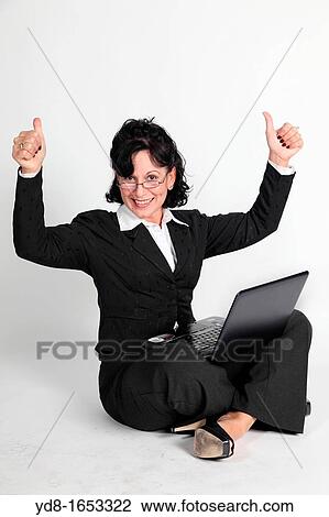 Female executive working with the laptop View Large Photo Image Stock Image - Female executive working with the laptop. Fotosearch