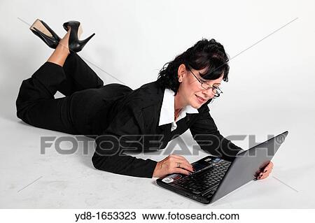 Female executive working with the laptop View Large Photo Image Stock Image - Female executive working with the laptop. Fotosearch
