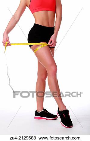 Female fitness model measuring volumes. View Large Photo Image Stock Photo - Female fitness model measuring volumes.. Fotosearch