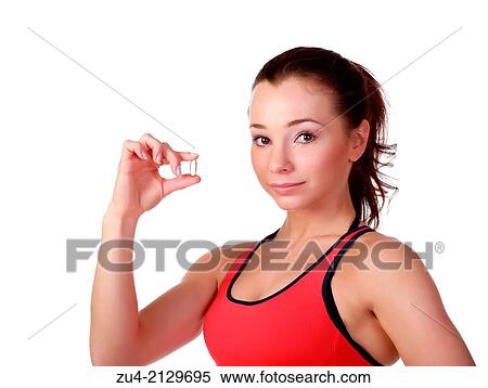 Stock Photography - Female fitness model with Omega-3 acid pills.. Fotosearch
