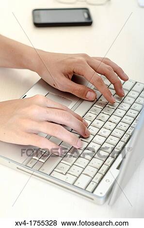 Female Hands over notebook keyboard View Large Photo Image Stock Photo - Female Hands over notebook keyboard. Fotosearch