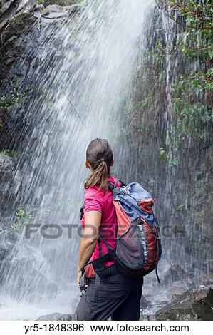 Female hiker at mountain waterfall on Gran Canaria, Canary Islands, Spain View Large Photo Image Stock Photograph - Female hiker at mountain waterfall on Gran Canaria, Canary Islands, Spain. Fotosearch